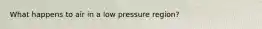 What happens to air in a low pressure region?