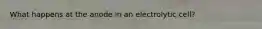 What happens at the anode in an electrolytic cell?