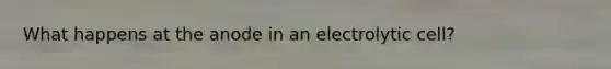 What happens at the anode in an electrolytic cell?