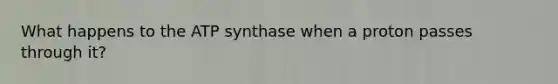 What happens to the ATP synthase when a proton passes through it?