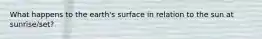 What happens to the earth's surface in relation to the sun at sunrise/set?
