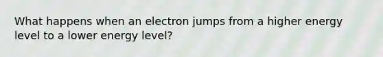 What happens when an electron jumps from a higher energy level to a lower energy level?