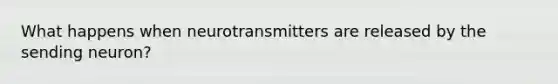 What happens when neurotransmitters are released by the sending neuron?