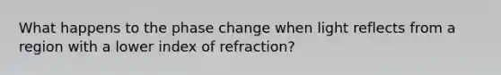 What happens to the phase change when light reflects from a region with a lower index of refraction?