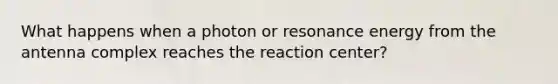 What happens when a photon or resonance energy from the antenna complex reaches the reaction center?