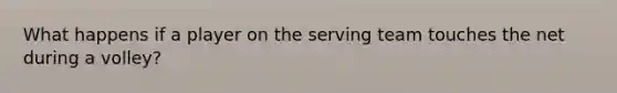 What happens if a player on the serving team touches the net during a volley?