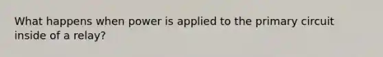What happens when power is applied to the primary circuit inside of a relay?