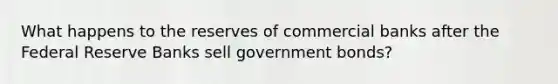 What happens to the reserves of commercial banks after the Federal Reserve Banks sell government bonds?