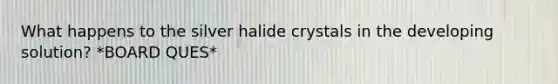 What happens to the silver halide crystals in the developing solution? *BOARD QUES*