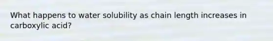 What happens to water solubility as chain length increases in carboxylic acid?