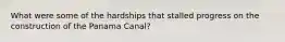 What were some of the hardships that stalled progress on the construction of the Panama Canal?