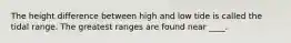 The height difference between high and low tide is called the tidal range. The greatest ranges are found near ____.