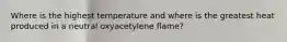 Where is the highest temperature and where is the greatest heat produced in a neutral oxyacetylene flame?