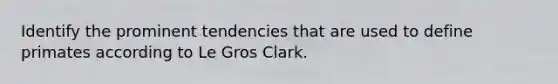 Identify the prominent tendencies that are used to define primates according to Le Gros Clark.