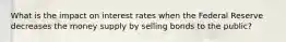 What is the impact on interest rates when the Federal Reserve decreases the money supply by selling bonds to the public?