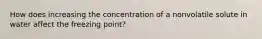 How does increasing the concentration of a nonvolatile solute in water affect the freezing point?