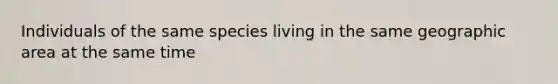 Individuals of the same species living in the same geographic area at the same time