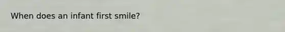 When does an infant first smile?