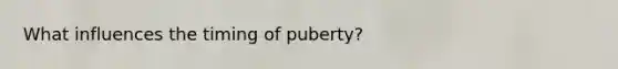 What influences the timing of puberty?