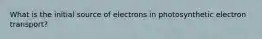 What is the initial source of electrons in photosynthetic electron transport?