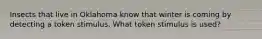 Insects that live in Oklahoma know that winter is coming by detecting a token stimulus. What token stimulus is used?