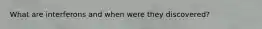 What are interferons and when were they discovered?