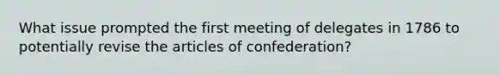 What issue prompted the first meeting of delegates in 1786 to potentially revise the articles of confederation?