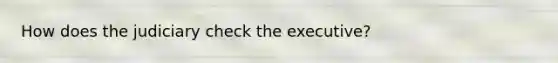 How does the judiciary check the executive?