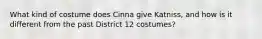 What kind of costume does Cinna give Katniss, and how is it different from the past District 12 costumes?