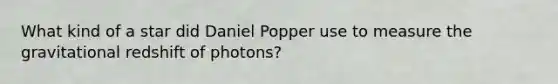 What kind of a star did Daniel Popper use to measure the gravitational redshift of photons?