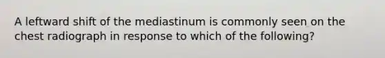 A leftward shift of the mediastinum is commonly seen on the chest radiograph in response to which of the following?