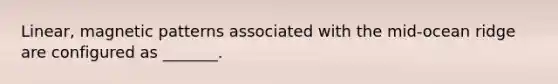 Linear, magnetic patterns associated with the mid-ocean ridge are configured as _______.