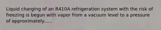 Liquid charging of an R410A refrigeration system with the risk of freezing is begun with vapor from a vacuum level to a pressure of approximately......