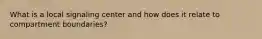 What is a local signaling center and how does it relate to compartment boundaries?