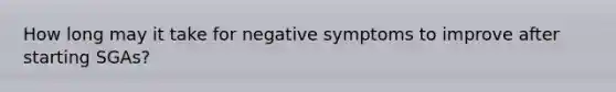 How long may it take for negative symptoms to improve after starting SGAs?