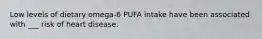 Low levels of dietary omega-6 PUFA intake have been associated with ___ risk of heart disease.