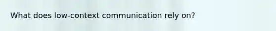 What does low-context communication rely on?