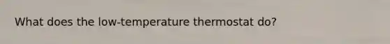 What does the low-temperature thermostat do?