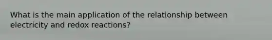 What is the main application of the relationship between electricity and redox reactions?