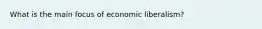 What is the main focus of economic liberalism?