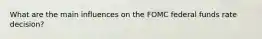 What are the main influences on the FOMC federal funds rate decision?
