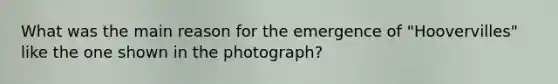 What was the main reason for the emergence of "Hoovervilles" like the one shown in the photograph?