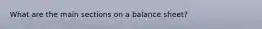 What are the main sections on a balance sheet?
