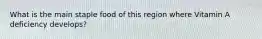 What is the main staple food of this region where Vitamin A deficiency develops?