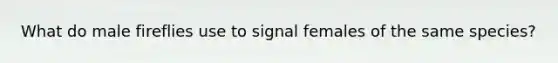 What do male fireflies use to signal females of the same species?