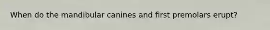 When do the mandibular canines and first premolars erupt?