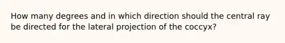 How many degrees and in which direction should the central ray be directed for the lateral projection of the coccyx?