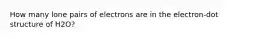 How many lone pairs of electrons are in the electron-dot structure of H2O?