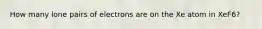 How many lone pairs of electrons are on the Xe atom in XeF6?