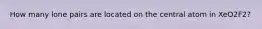 How many lone pairs are located on the central atom in XeO2F2?